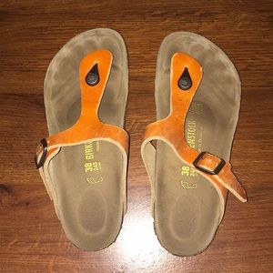 Orange thong strapped birkenstocks